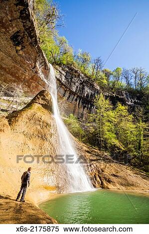 Stock Photography - The curious Cascade of Pain de Sucre near Surjoux with an outside stalagmite, Ain, Rh? ne-Alpes, France.. Fotosearch