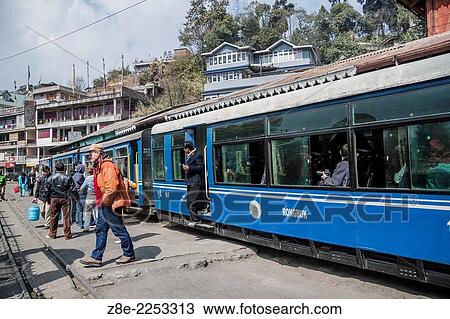 Stock Image - The Darjeeling Himalayan railway makes a halt at 'Ghum' station in Darjeeling, West Bengal, India. At an altitude of 7407 ft, (2257. 65 m), it is the highest train station in India. Fotosearch