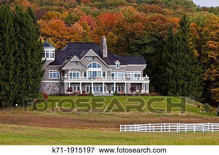 Stock Photo - The Dressage Brek-N-Ridge Farm ranch with fall foliage color along Highway 119 near Harbor Springs, Michigan, USA. Fotosearch