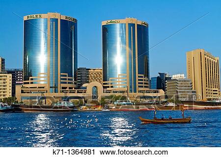 The Dubai Creek skyline office towers with Dow boats in Dubai, UAE, Persian Gulf View Large Photo Image Stock Image - The Dubai Creek skyline office towers with Dow boats in Dubai, UAE, Persian Gulf. Fotosearch