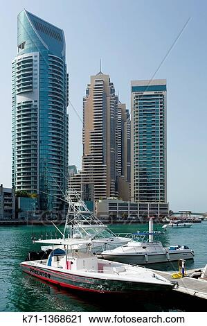 The Dubai Marina with high rise buildings and boats in Dubai, UAE, Persian Gulf View Large Photo Image Stock Image - The Dubai Marina with high rise buildings and boats in Dubai, UAE, Persian Gulf. Fotosearch