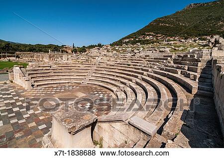 The Ekklesiasterion, assembly hall, at Ancient Messene Ithomi with the modern village of Mavromati in the background, Messinia, Southern Peloponnese, Greece View Large Photo Image Stock Photo - The Ekklesiasterion, assembly hall, at Ancient Messene Ithomi with the modern village of Mavromati in the background, Messinia, Southern Peloponnese, Greece. Fotosearch