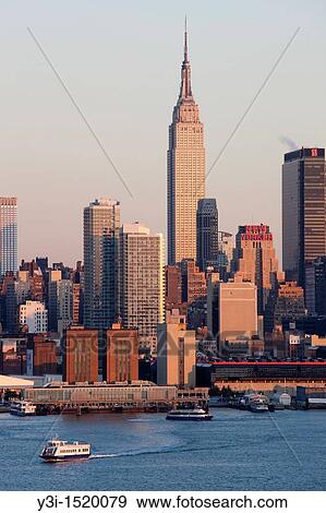 The Empire State Building and Manhattan skyline on the west side of Manhattan, New York City, New York, USA as seen from Weehawken, New Jersey View Large Photo Image Stock Photo - The Empire State Building and Manhattan skyline on the west side of Manhattan, New York City, New York, USA as seen from Weehawken, New Jersey. Fotosearch