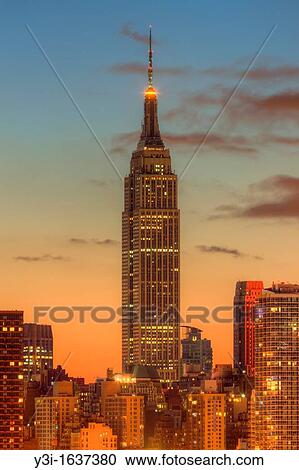 The Empire State Building during morning twilight as viewed over the Hudson River looking east from New Jersey The eastern sky and clouds were accented with tinges of orange that began to show in the hour before sunrise View Large Photo Image Stock Image - The Empire State Building during morning twilight as viewed over the Hudson River looking east from New Jersey The eastern sky and clouds were accented with tinges of orange that began to show in the hour before sunrise. Fotosearch