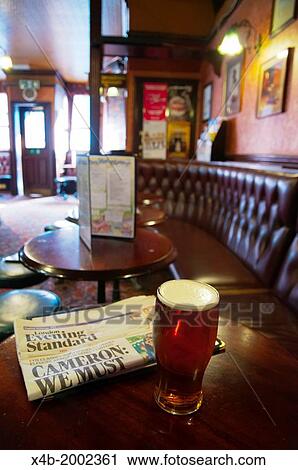 the Evening Standard newspaper and a pint of beer Fitzroy tavern pub London England Britain UK Europe. View Large Photo Image Stock Image - the Evening Standard newspaper and a pint of beer Fitzroy tavern pub London England Britain UK Europe.. Fotosearch