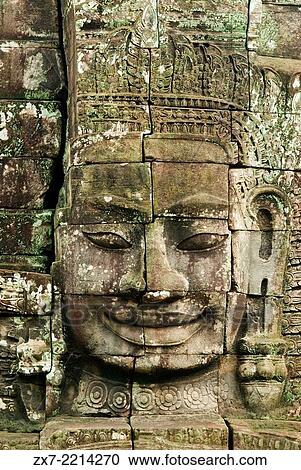 The faces of the Bayon temple. Angkor Thom. Angkor Thom was built as a square, the sides of which run exactly north to south and east to west. Standing in the exact center of the walled city, Bayon Temple represents the intersection of heaven and earth. View Large Photo Image Stock Image - The faces of the Bayon temple. Angkor Thom. Angkor Thom was built as a square, the sides of which run exactly north to south and east to west. Standing in the exact center of the walled city, Bayon Temple represents the intersection of heaven and earth.. Fotosearch