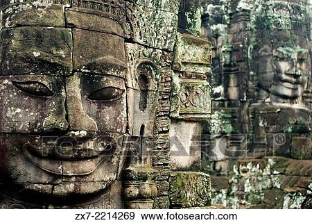Stock Photo - The faces of the Bayon temple. Angkor Thom. Angkor Thom was built as a square, the sides of which run exactly north to south and east to west. Standing in the exact center of the walled city, Bayon Temple represents the intersection of heaven and earth.. Fotosearch