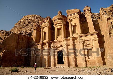 Stock Image - The famous and elaborately carved fa? ade of Al Deir (the Monastery), carved out of a sandstone rock face. Jordan (Hashemite Kingdom of), Ma'an Governorate (Maan), ancient city of Petra. Model Released.. Fotosearch