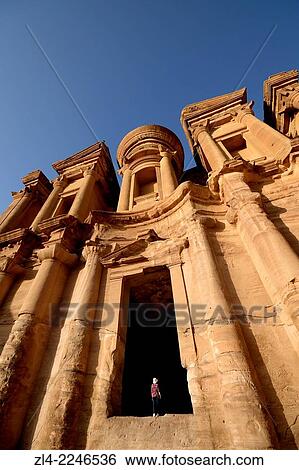 The famous and elaborately carved fa? ade of Al Deir (the Monastery), carved out of a sandstone rock face, low-angle shot. Jordan (Hashemite Kingdom of), Ma'an Governorate (Maan), ancient city of Petra. Model Released. View Large Photo Image Stock Photograph - The famous and elaborately carved fa? ade of Al Deir (the Monastery), carved out of a sandstone rock face, low-angle shot. Jordan (Hashemite Kingdom of), Ma'an Governorate (Maan), ancient city of Petra. Model Released.. Fotosearch