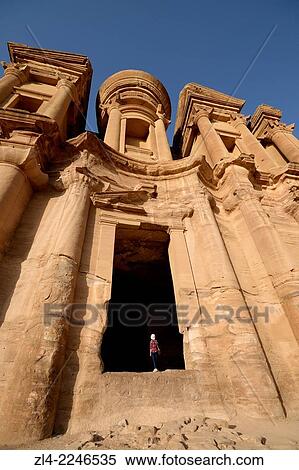 The famous and elaborately carved fa? ade of Al Deir (the Monastery), carved out of a sandstone rock face, low-angle shot. Jordan (Hashemite Kingdom of), Ma'an Governorate (Maan), ancient city of Petra. Model Released. View Large Photo Image Stock Photography - The famous and elaborately carved fa? ade of Al Deir (the Monastery), carved out of a sandstone rock face, low-angle shot. Jordan (Hashemite Kingdom of), Ma'an Governorate (Maan), ancient city of Petra. Model Released.. Fotosearch
