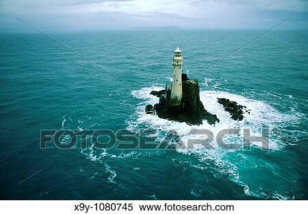 Stock Photography - The Fastnet Rock Light Lighthouse off the Atlantic coast of County Cork, south west Ireland. Fotosearch