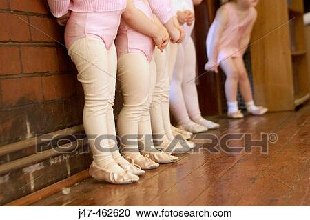 The feet and legs of a group of 3 year old girls in ballet class, dressed in pink leotards and tights, standing in a line View Large Photo Image Stock Image - The feet and legs of a group of 3 year old girls in ballet class, dressed in pink leotards and tights, standing in a line. Fotosearch