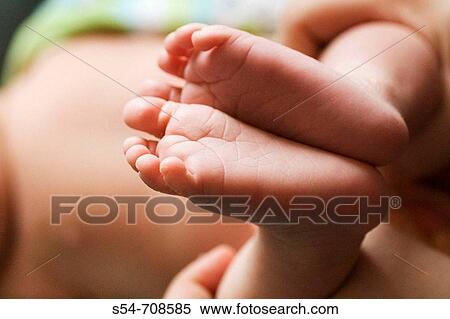 The feet of a two-week-old caucasian baby boy View Large Photo Image Stock Photography - The feet of a two-week-old caucasian baby boy. Fotosearch