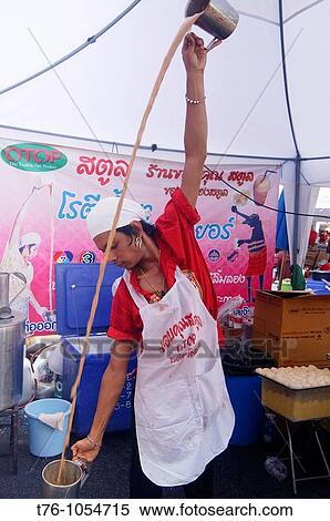 the fine art of pouring tea in Bangkok Thailand View Large Photo Image Stock Photography - the fine art of pouring tea in Bangkok Thailand. Fotosearch
