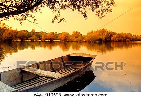 The fishing boat on the lake by the river Maly Dunaj near Kolarovo, Slovakia View Large Photo Image Stock Photo - The fishing boat on the lake by the river Maly Dunaj near Kolarovo, Slovakia. Fotosearch