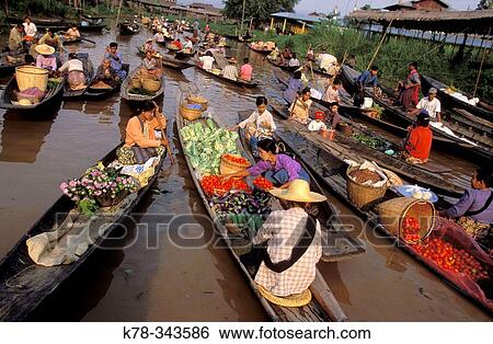 The floating market at Ywama, which takes place every 5 days and serves the local residences of the Inle Lake, Shan State, Myanmar. View Large Photo Image Stock Photograph - The floating market at Ywama, which takes place every 5 days and serves the local residences of the Inle Lake, Shan State, Myanmar.. Fotosearch