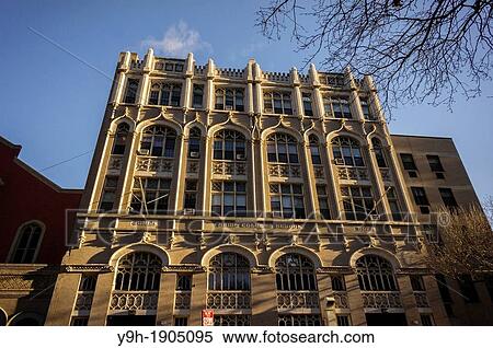Stock Photography - The former St Columba School owned by the Archdiocese of New York in the Chelsea neighborhood of New York The school was closed in 2006 and the building has been leased to the McCarton School which teaches children with autism. Fotosearch