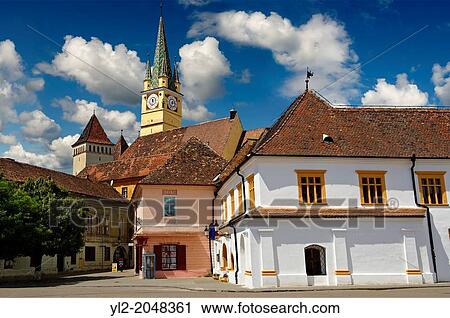 The Fortified Saxon Church of Medias started in 1438, with the 68 mt high Gothic trumpeters tower of St Margret church. Medias was the largest fortified Saxon Church complex of its time with double walls & a moat. Transylvania. View Large Photo Image Stock Image - The Fortified Saxon Church of Medias started in 1438, with the 68 mt high Gothic trumpeters tower of St Margret church. Medias was the largest fortified Saxon Church complex of its time with double walls & a moat. Transylvania.. Fotosearch