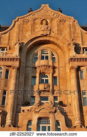 Stock Photo - The Four Seasons Hotel Gresham Palace in Budapest, Hungary. The Gresham Palace in Budapest was built in the Art Nouveau architecture that went from being a home, to offices, to apartments and now a hotel across the street from the Chain Bride.. Fotosearch