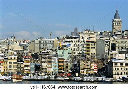 The Galata Tower rising above the city along the Bosphorus strait, Istanbul, Turkey. View Large Photo Image Picture - The Galata Tower rising above the city along the Bosphorus strait, Istanbul, Turkey.. Fotosearch