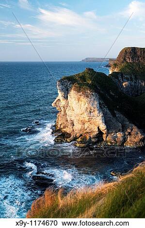 The Giants Head limestone cliff landmark at the White Rocks near Portrush, Northern Ireland Looking east to the Giants Causeway headlands View Large Photo Image Stock Image - The Giants Head limestone cliff landmark at the White Rocks near Portrush, Northern Ireland Looking east to the Giants Causeway headlands. Fotosearch