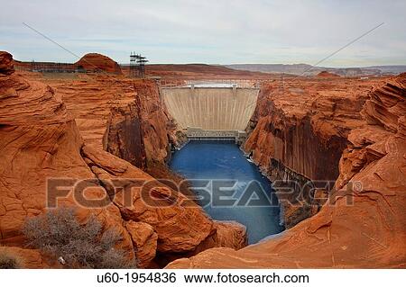 Stock Photograph - The Glen Canyon Dam backs up the Colorado River to form Lake powell in Arizona.. Fotosearch