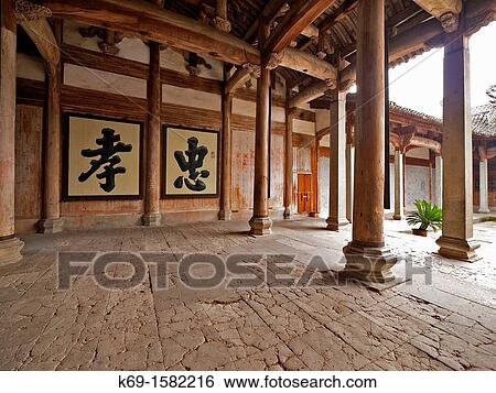 Stock Photograph - The Hall of Dun Ben The Ancestral temple for Men Built during the reign of Emperor Jia Qing in the Qing Dynasty 1801 AD, housing an area of 753 square mters and has five rooms in three rows. Fotosearch