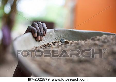 The hand of a woman holding a tub carrying gravel for construction, India. View Large Photo Image Stock Photo - The hand of a woman holding a tub carrying gravel for construction, India.. Fotosearch