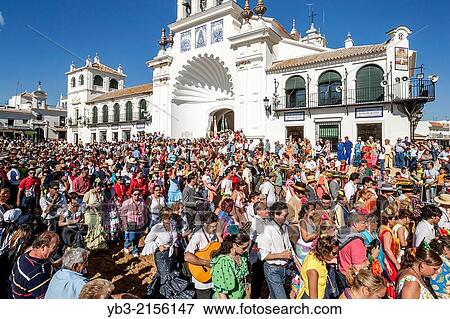 Stock Photo - The Hermandades Pass By The Sanctuario de Nuestra Seora de El Roc? o; El Rocio Festival, El Rocio, Andalusia, Spain.. Fotosearch