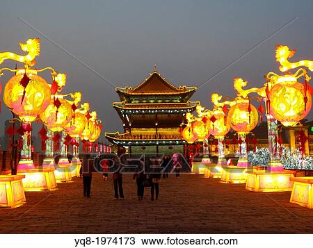 Stock Image - The historic drum tower in the center of the old city at night, Xian, China. Fotosearch