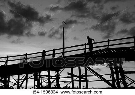 The historical woodan Bridge from Sanglaburi at dusk View Large Photo Image Picture - The historical woodan Bridge from Sanglaburi at dusk. Fotosearch