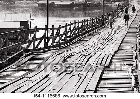 Stock Photograph - The historical woodan Bridge from Sanglaburi. Fotosearch