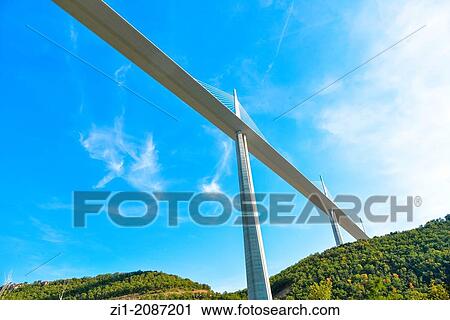 Stock Image - the huge suspension bridge over the Tarn river in Millau, France. Fotosearch