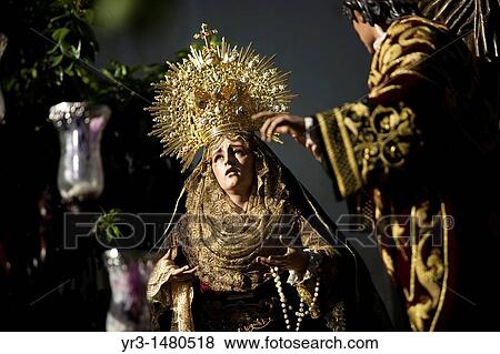The image of Nuestra Seora de los Desamparados virgin is displayed by the Penas de Santiago brotherhood during an Easter Holy Week procession in Cordoba, Andalusia, Spain, April 17, 2011 View Large Photo Image Stock Photo - The image of Nuestra Seora de los Desamparados virgin is displayed by the Penas de Santiago brotherhood during an Easter Holy Week procession in Cordoba, Andalusia, Spain, April 17, 2011. Fotosearch