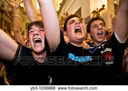Stock Photo - The Istrice Contrada celebrate winning the July 2008 Palio in the Provenzano Church, Siena, Italy. Fotosearch