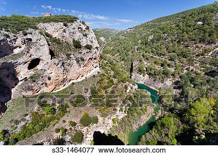 The Jucar riverbank and Serran? a from El Ventano del Diablo Cuenca Castilla la Mancha Spain View Large Photo Image Stock Photo - The Jucar riverbank and Serran? a from El Ventano del Diablo Cuenca Castilla la Mancha Spain. Fotosearch
