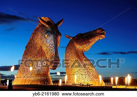 The Kelpies with the light, sound and fire performance by the renowned pyrotechnic company GROUP F, The Kelpies, are a colossal 300 tonne, 30 metre high horse head sculpture by artist Andy Scott. View Large Photo Image Stock Image - The Kelpies with the light, sound and fire performance by the renowned pyrotechnic company GROUP F, The Kelpies, are a colossal 300 tonne, 30 metre high horse head sculpture by artist Andy Scott.. Fotosearch