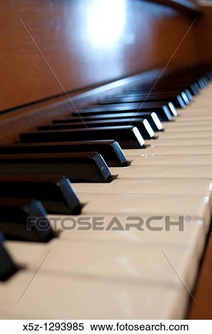 The keys of an old Piano in the light View Large Photo Image Stock Photography - The keys of an old Piano in the light. Fotosearch