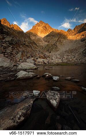 The last light of day illuminates the Balaitus an intense golden hue View Large Photo Image Stock Image - The last light of day illuminates the Balaitus an intense golden hue. Fotosearch