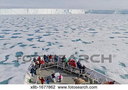 Stock Image - The Lindblad Expedition ship National Geographic Explorer at Austfonna in the Svalbard Archipelago, Norway. Fotosearch