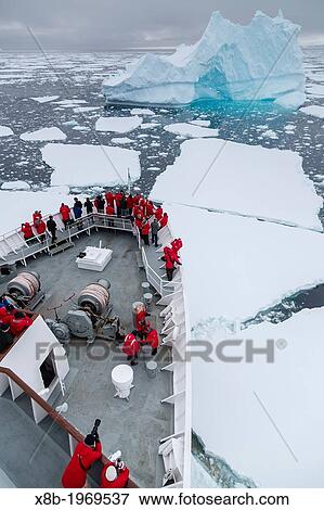 Stock Photo - The Lindblad Expedition ship National Geographic Explorer on expedition in Crystal Sound, below the Antarctic Circle, Antarctica, Southern Ocean.. Fotosearch