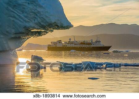 The Lindblad Expeditions ship National Geographic Explorer amongst grounded icebergs near Rode O Red Island, Scoresbysund, Northeast Greenland View Large Photo Image Picture - The Lindblad Expeditions ship National Geographic Explorer amongst grounded icebergs near Rode O Red Island, Scoresbysund, Northeast Greenland. Fotosearch
