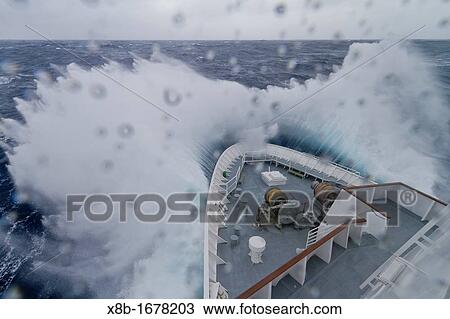 Stock Image - The Lindblad Expeditions ship National Geographic Explorer in a Beaufort Scale 10 storm 35 foot seas and 50+ knot winds in the Drake Passage between the Antarctic Peninsula and South America. Fotosearch