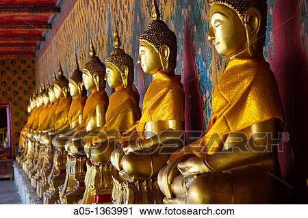 The long line of golden Buddhas in Wat Arun, The Temple of the Dawn Bangkok, Thailand, Southeast Asia, Asia. View Large Photo Image Stock Image - The long line of golden Buddhas in Wat Arun, The Temple of the Dawn Bangkok, Thailand, Southeast Asia, Asia.. Fotosearch