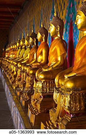 The long line of golden Buddhas in Wat Arun, The Temple of the Dawn Bangkok, Thailand, Southeast Asia, Asia. View Large Photo Image Stock Image - The long line of golden Buddhas in Wat Arun, The Temple of the Dawn Bangkok, Thailand, Southeast Asia, Asia.. Fotosearch