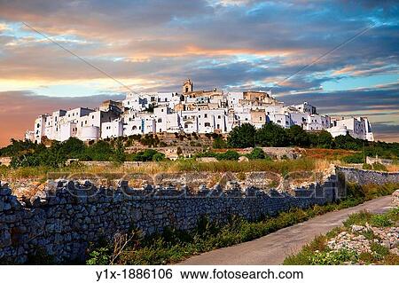 The medieval white fortified hill town walls of Ostuni, The White Town, Puglia, Italy View Large Photo Image Stock Photograph - The medieval white fortified hill town walls of Ostuni, The White Town, Puglia, Italy. Fotosearch