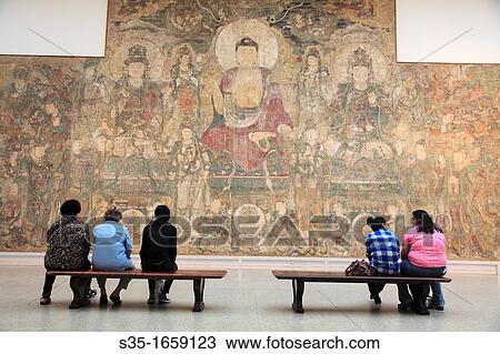 Stock Image - The mural of Buddha of Medicine Bhaishajyaguru Yaoshi from Yuan dynasty of China display in the Ancient Chinese Art collection in Metropolitan Museum of Art Manhattan New York City USA.. Fotosearch