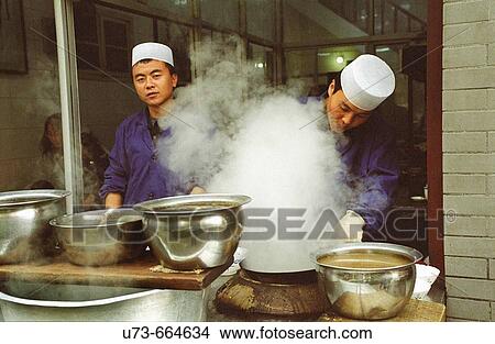 The Muslim Chefs in a local small restaurant in Xian's old muslim quarter, China View Large Photo Image Picture - The Muslim Chefs in a local small restaurant in Xian's old muslim quarter, China. Fotosearch