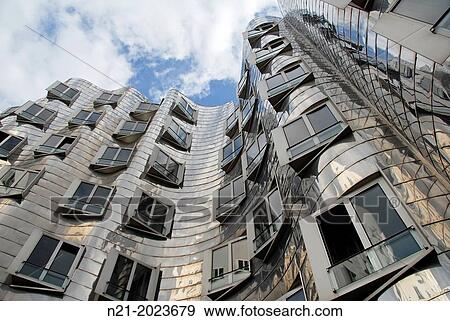 The Neue Zollhof Complex by architect Frank O. Gehry at the eastern Rhine River harbourfront. Dusseldorf, North Rhine Westfalia, Germany, Europe. View Large Photo Image Stock Photo - The Neue Zollhof Complex by architect Frank O. Gehry at the eastern Rhine River harbourfront. Dusseldorf, North Rhine Westfalia, Germany, Europe.. Fotosearch