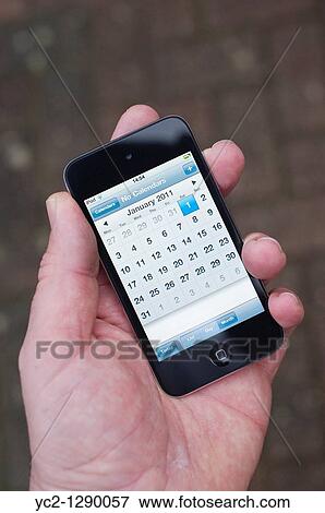 The new Apple Ipod touch 4th generation 4G 32gb media player with calendar showing New Years Day 2011 View Large Photo Image Stock Photo - The new Apple Ipod touch 4th generation 4G 32gb media player with calendar showing New Years Day 2011. Fotosearch